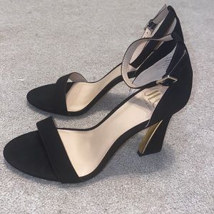 JLO Jennifer Lopez black heels with ankle strap.